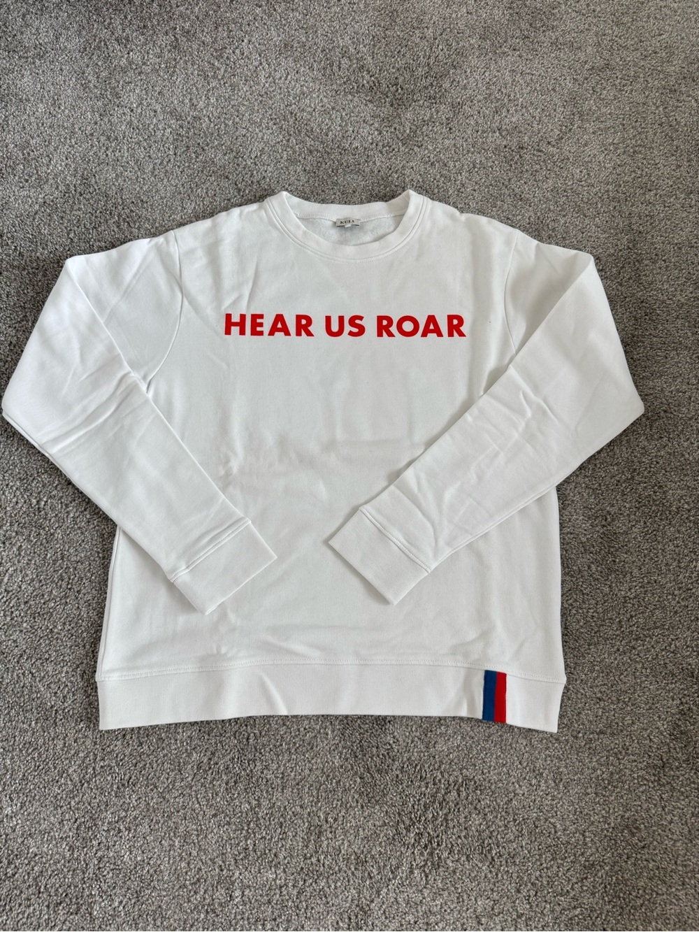 KULE White Crewneck Sweatshirt with Red Chest Logo and Blue-Red Hem Stripe